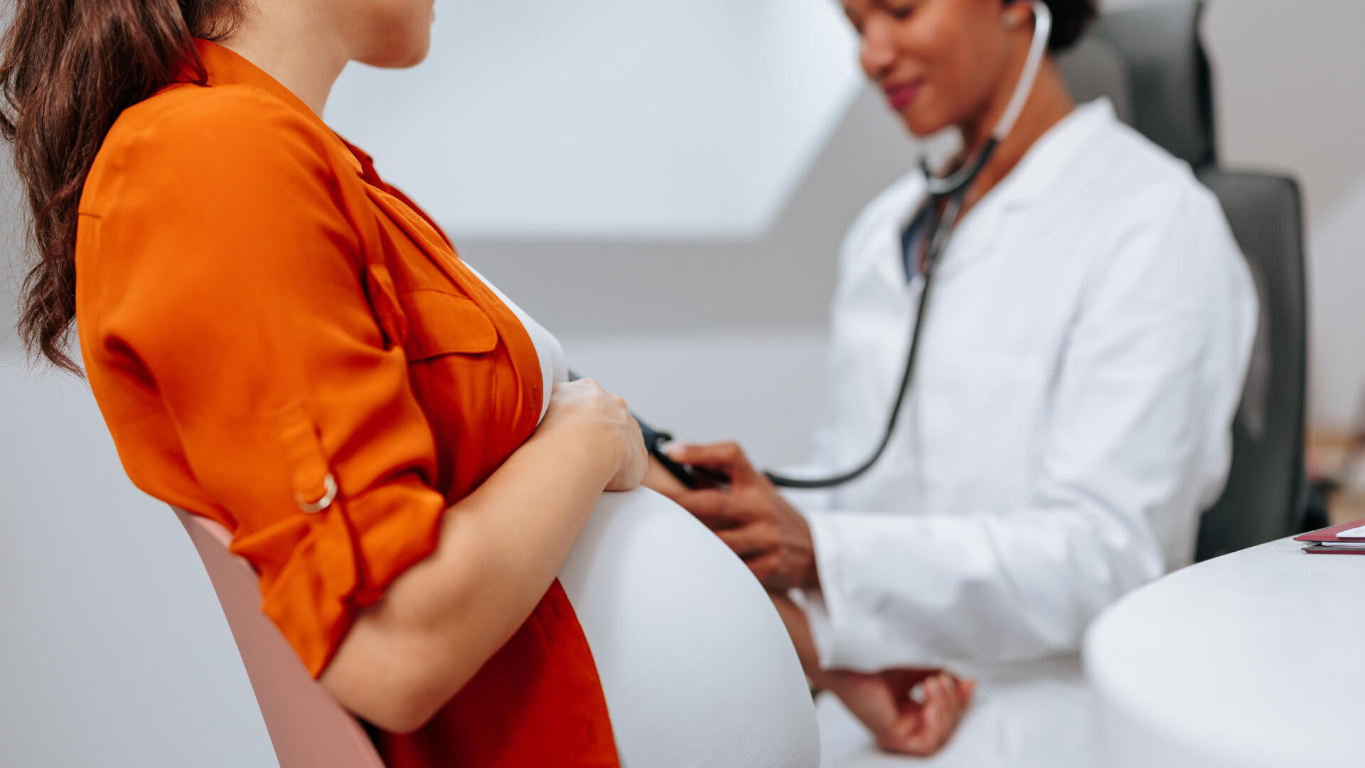 Doctor Checking Pregnant Patient Image