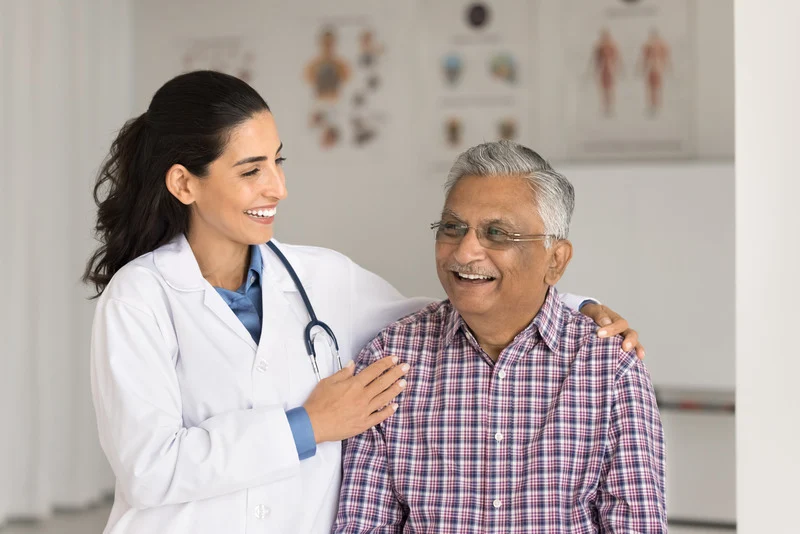 cheerful senior patient laughing in clinic office